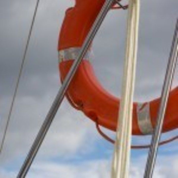 Lifebuoy hanging on back part of yacht