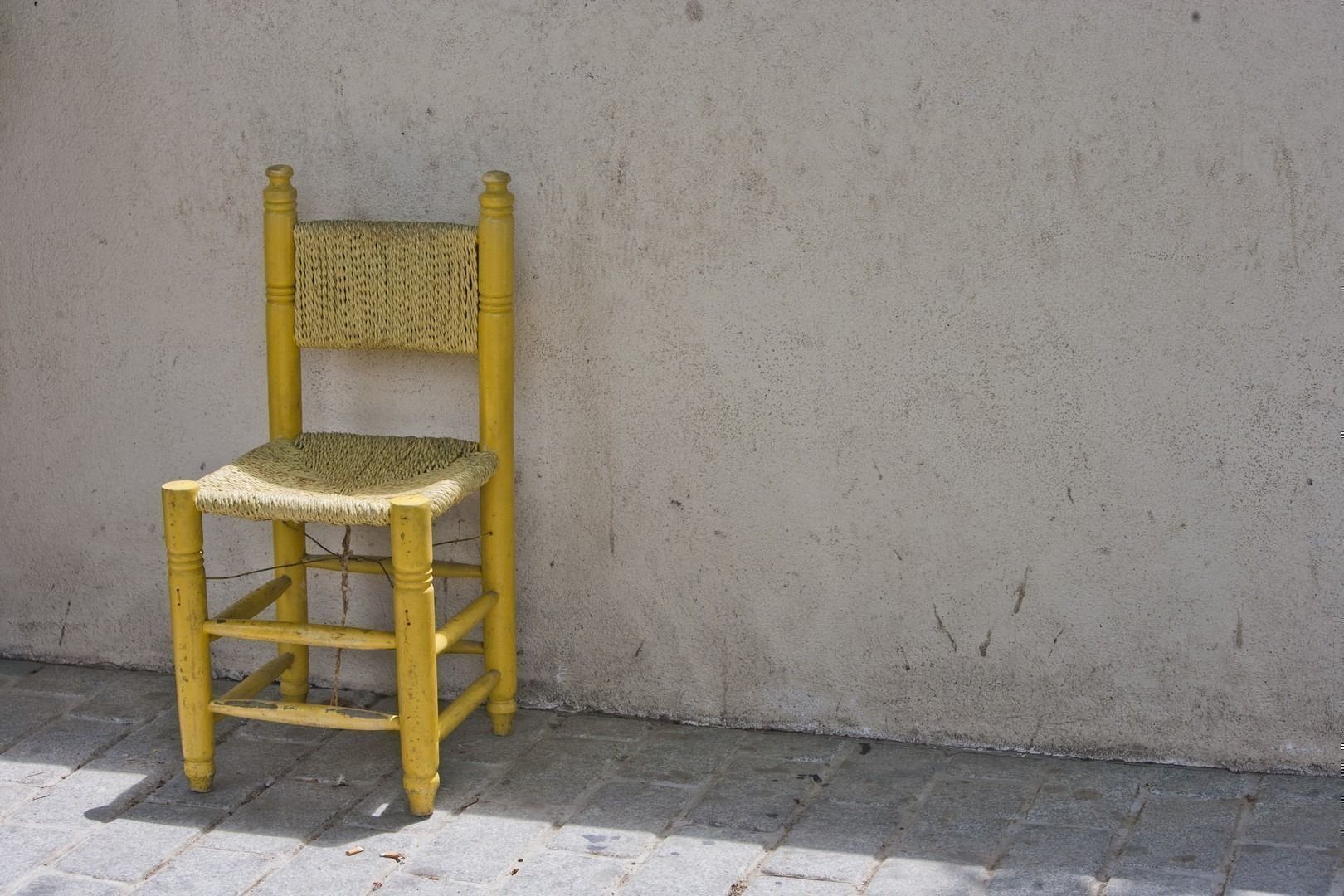 Yellow Chair against Brick Wall in Istanbul