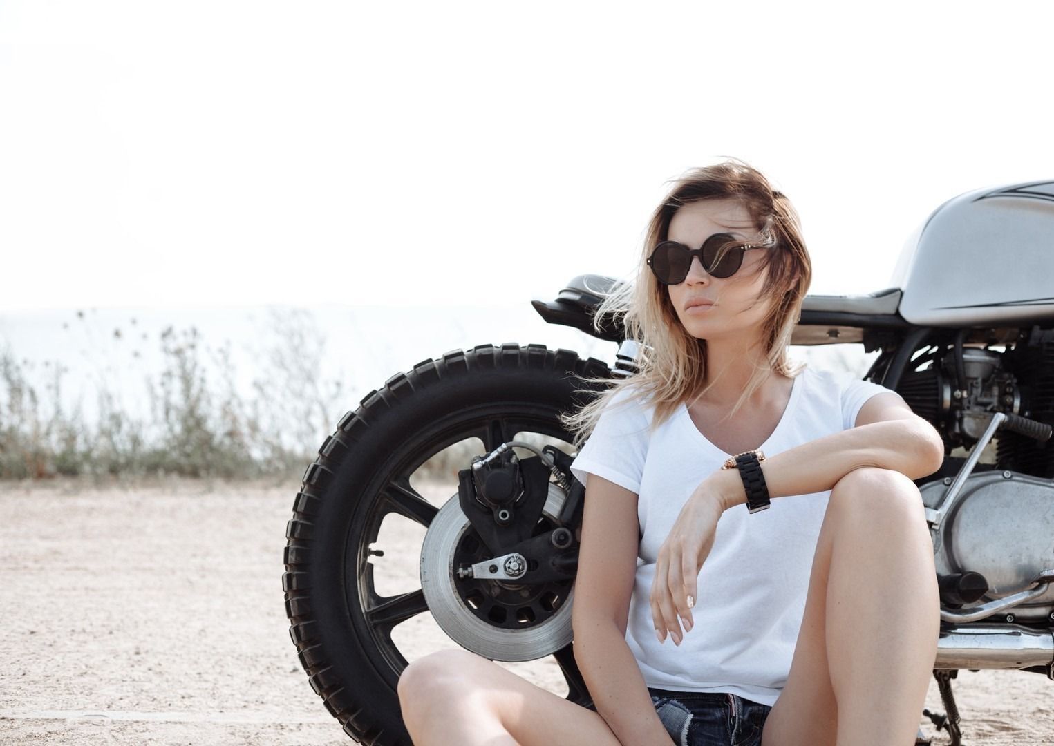 Biker girl and vintage custom motorcycle