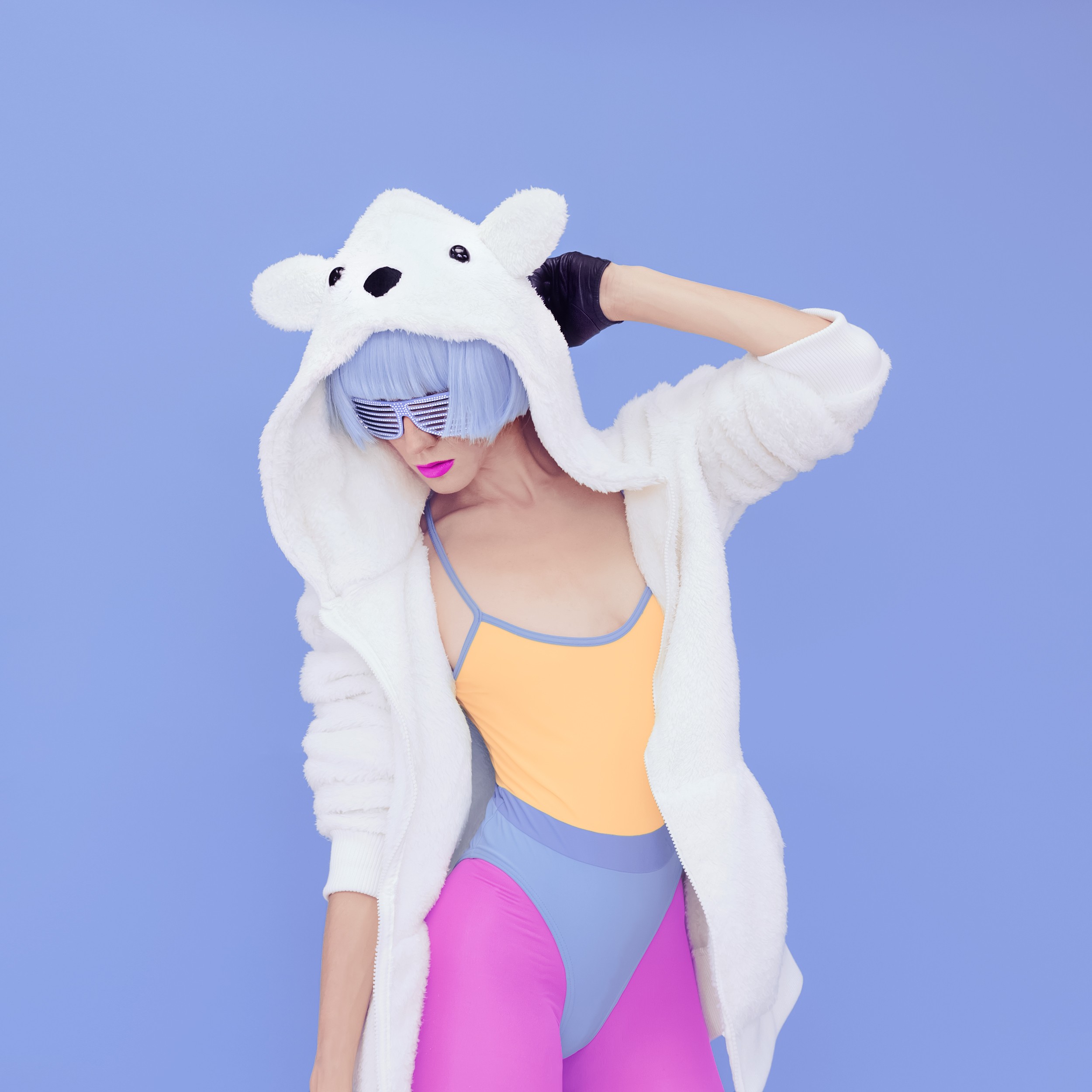 crazy girl in hoodie Teddy Bear on a blue background.